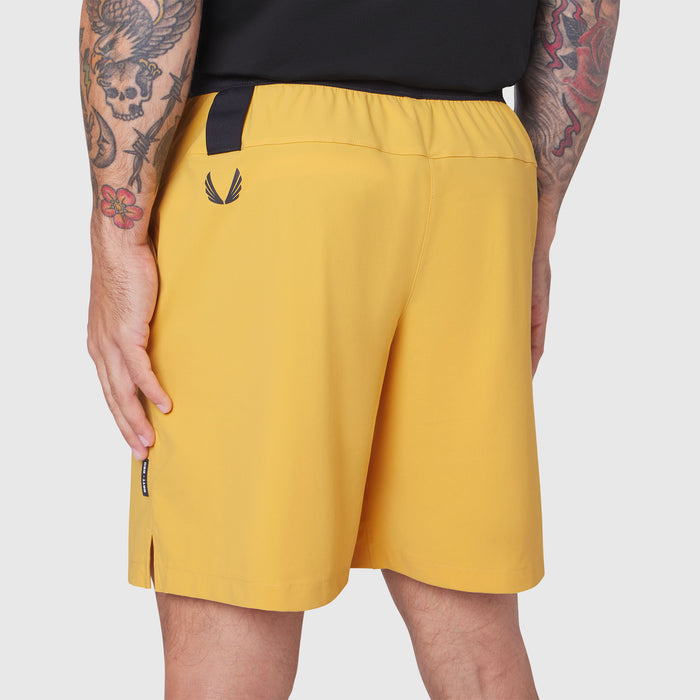 TETRA-LITE® 7" Linerless Training Short in amber, worn by model from side view