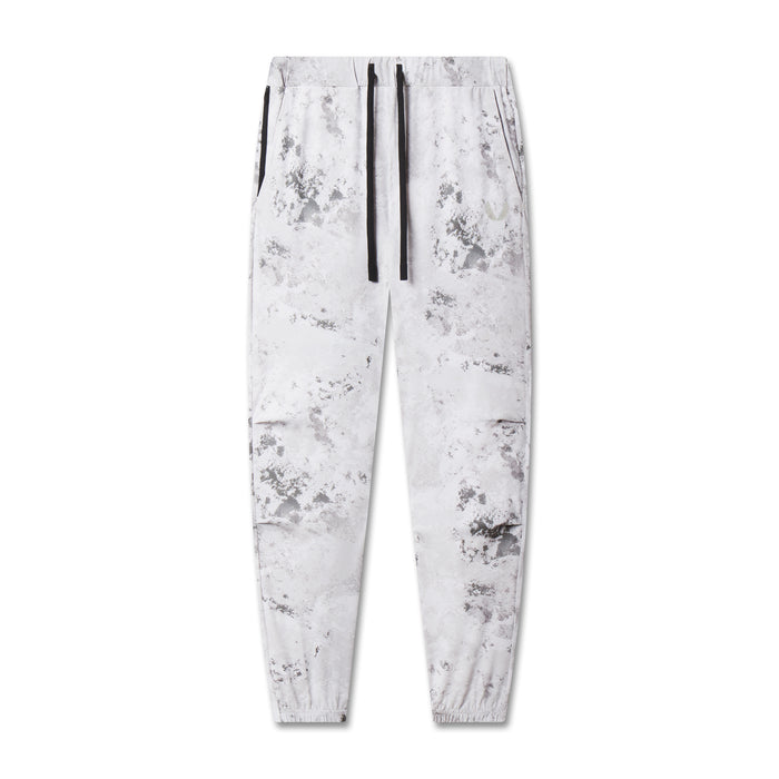 flatlay TETRA-LITE Training Jogger in Sedona Snow Camo white, front view