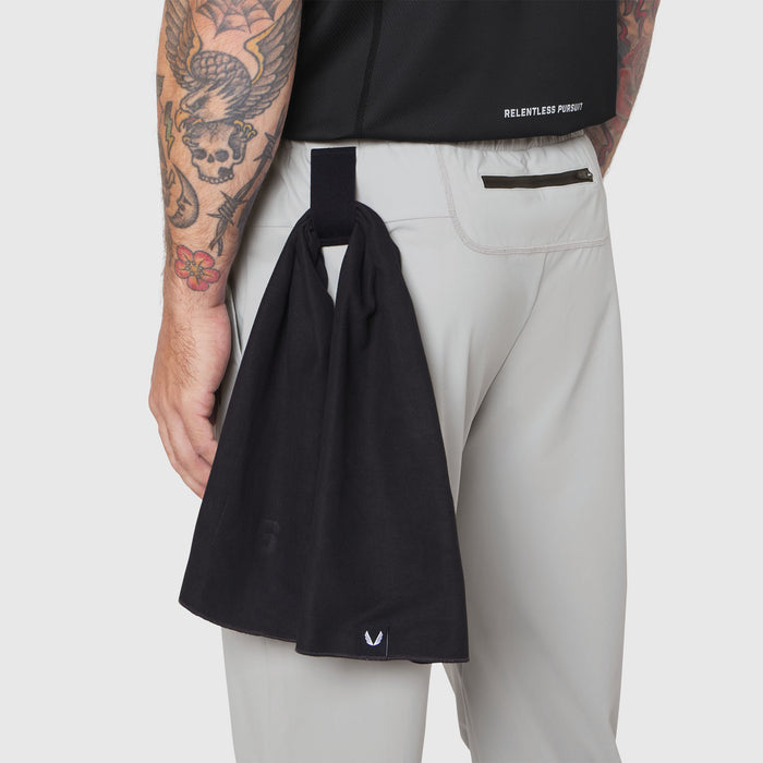 TETRA-LITE Training Jogger in slate grey, worn by model holding black tote bag
