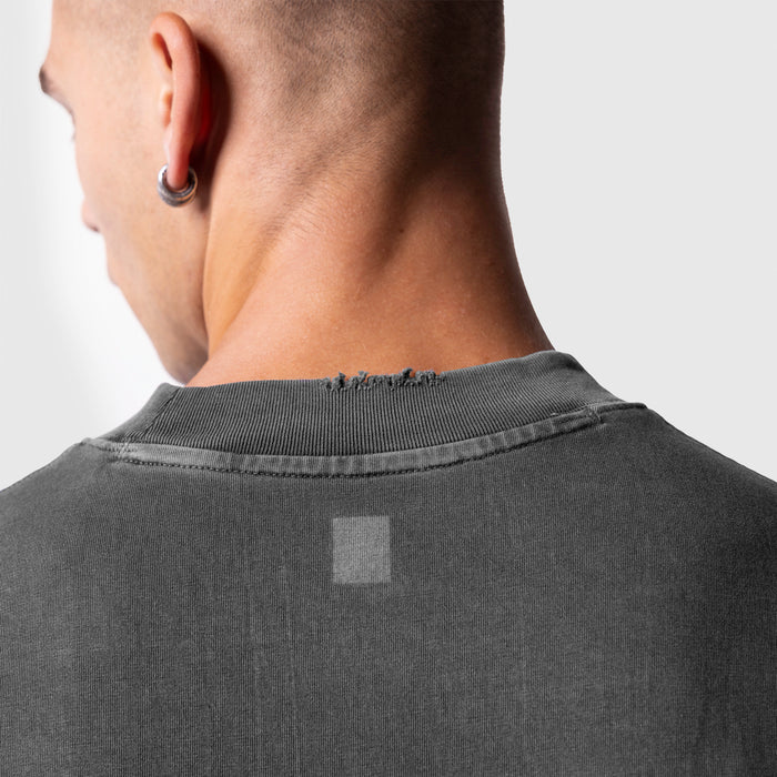 Model wearing ASRV Tech Essential Oversized Boxy Tee in Faded Grey, back view detail shot