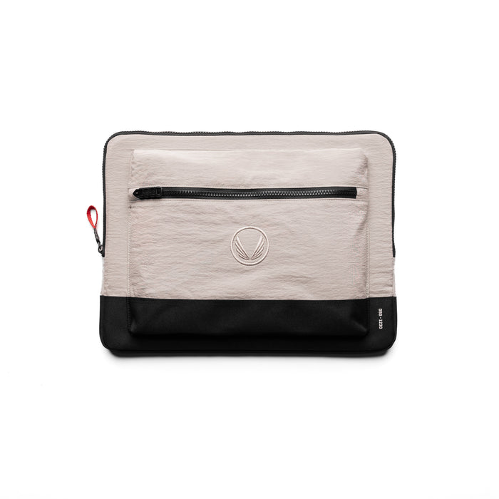 flatlay of Ripstop Laptop Bag in chai and black, front view showing zipper pocket and logo