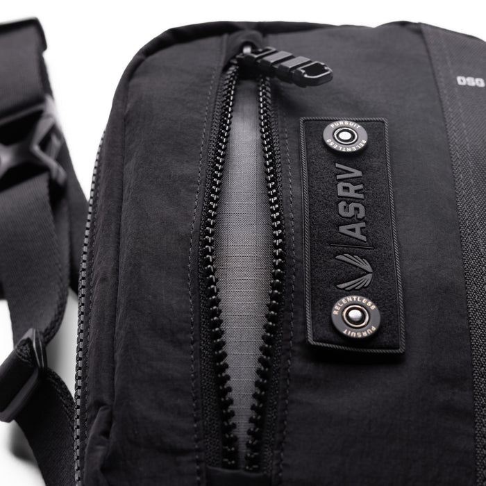 1231 Ripstop Crossbody Bag in black, worn and carried detail view