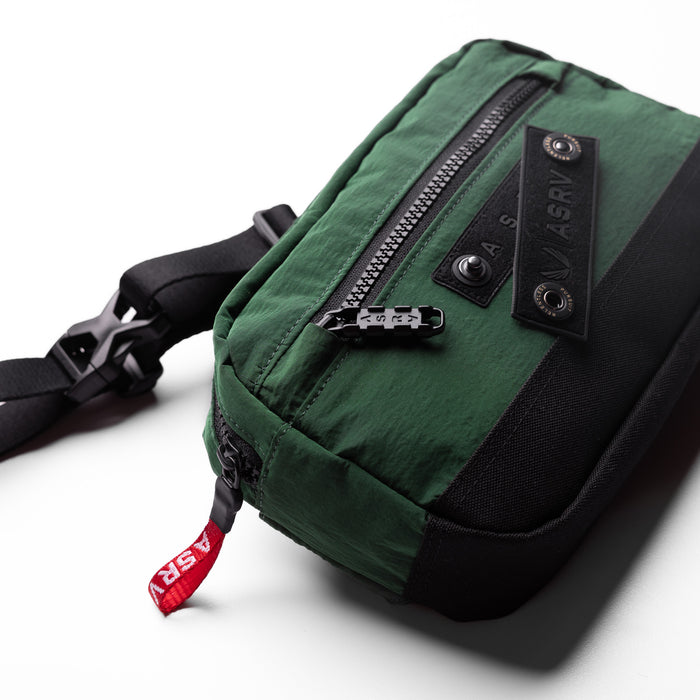 1231. Ripstop Crossbody Bag in forest green, worn with shoulder strap visible