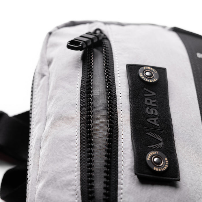 1231 Ripstop Crossbody Bag in Slate Grey, detail closeup of zipper and label