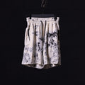 flatlay tie dye sweat shorts in cream and black, front view