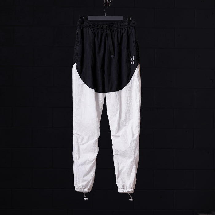 flatlay of 2021 Oversized Track Pant in black and white colorblock, front view