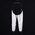 flatlay of 2021 Oversized Track Pant in black and white colorblock, front view