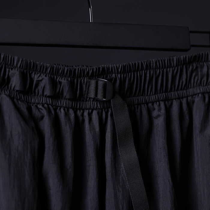 2021 Oversized Track Pant in black, detail shot of waistband and drawcord