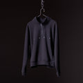 Navy quarter zip sweatshirt on hanger against black background, front view