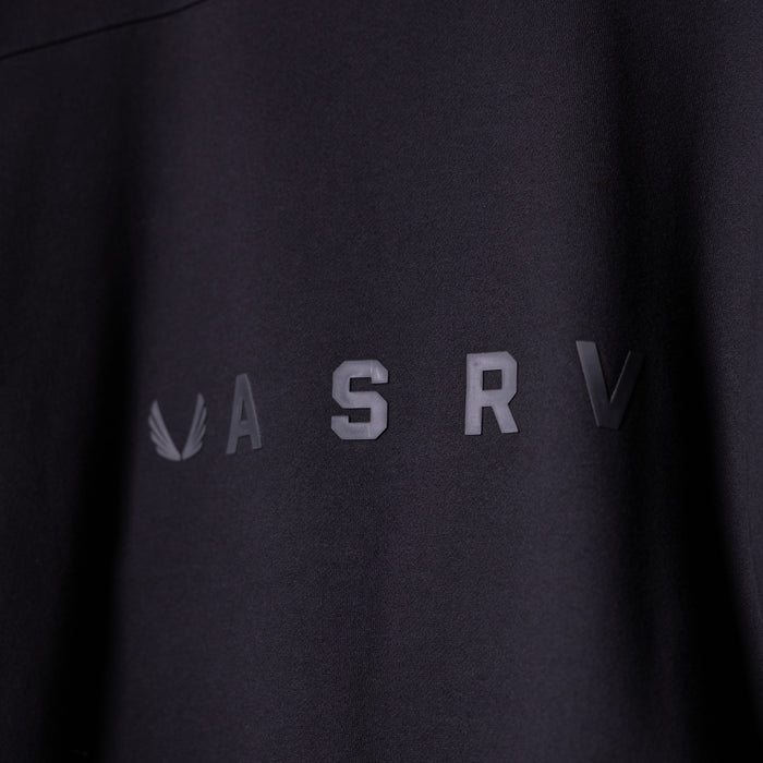 ASRV Zip Pocket Quarter Zip in black, worn on model showing chest logo detail