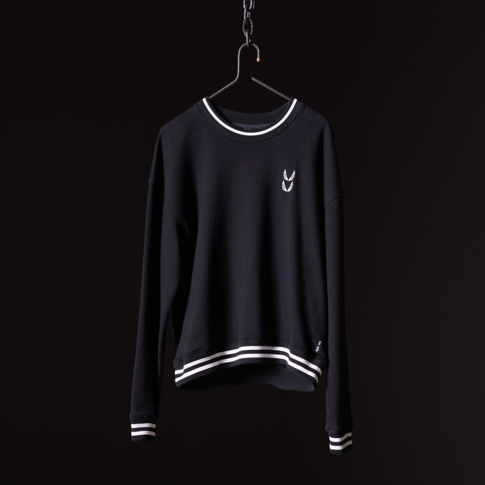Navy crew neck sweatshirt with white stripe trim on hanger against black background