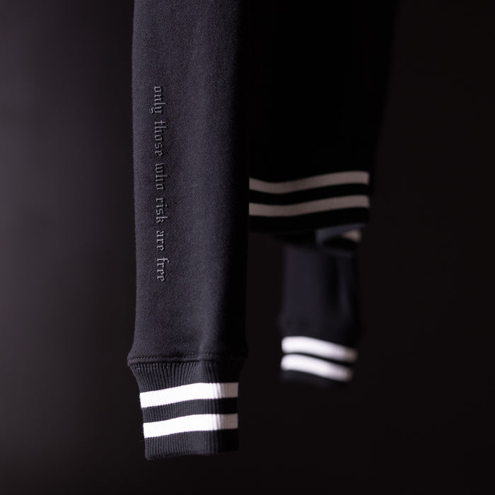 2022 Crew Neck Sweatshirt in charcoal gray with white striped cuffs, detail view