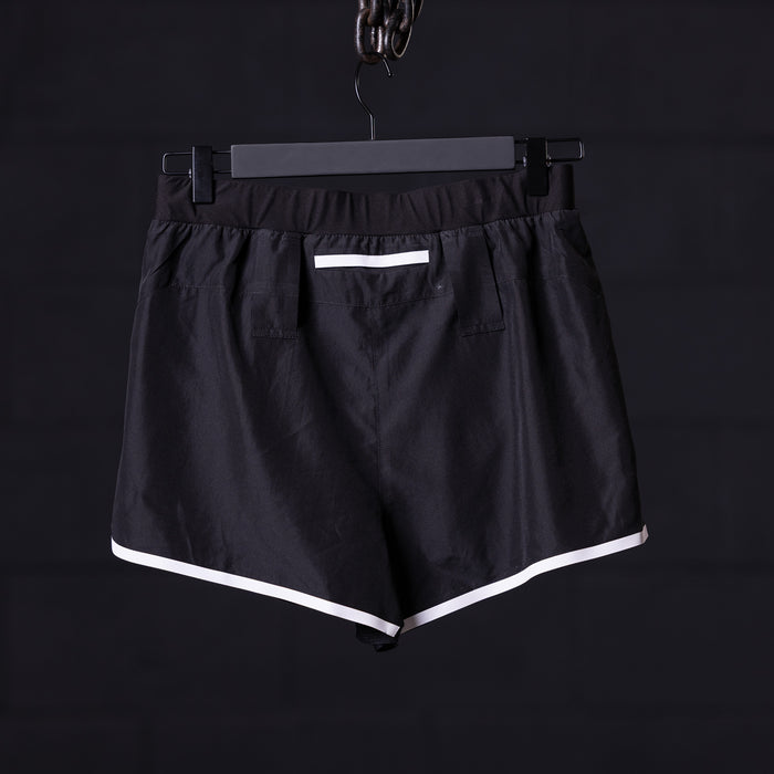 flatlay Reflective 3" Run Short in black with white trim, front view on hanger