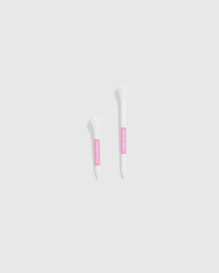 The image features two white tubes set against a light gray background, each with a pink label. The smaller tube is positioned on the left and is decorated with Psycho Bunny's 75 PACK GOLF TEES - B6A659C200, accented by bunny-themed designs. The larger tube is on the right, ideal for those looking for whimsical golf accessories from the Psycho Bunny brand.