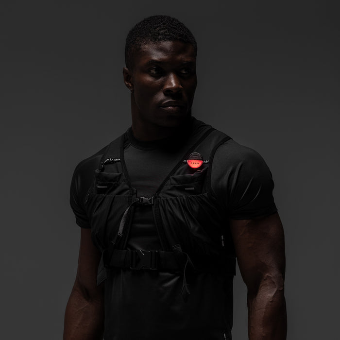 Black tactical vest worn by model, front view, ASRV x Bookman Eclipse