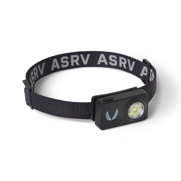 flatlay ASRV x Bookman Monocle headlamp in black with silver accents, front view