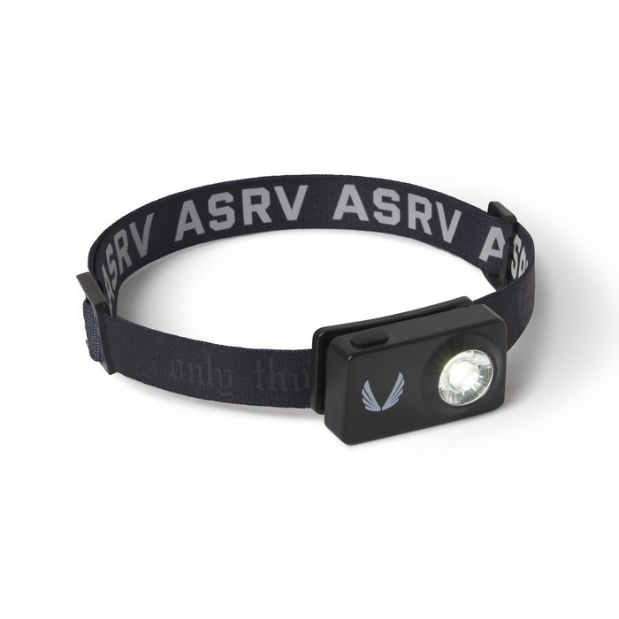 flatlay ASRV x Bookman Monocle headlamp in black with silver accents, front view