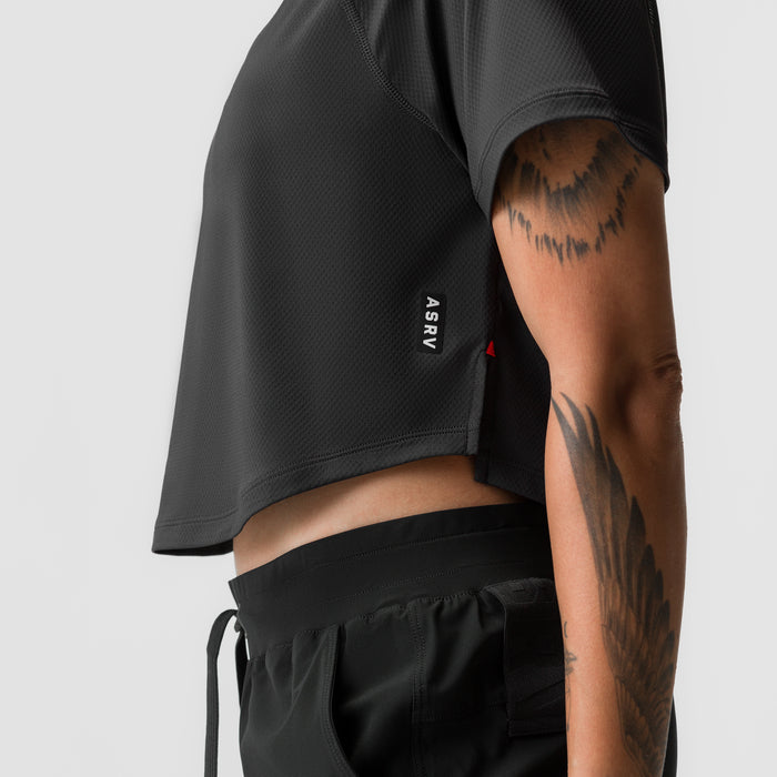 Black AeroSilver cropped training tee worn by model, side view