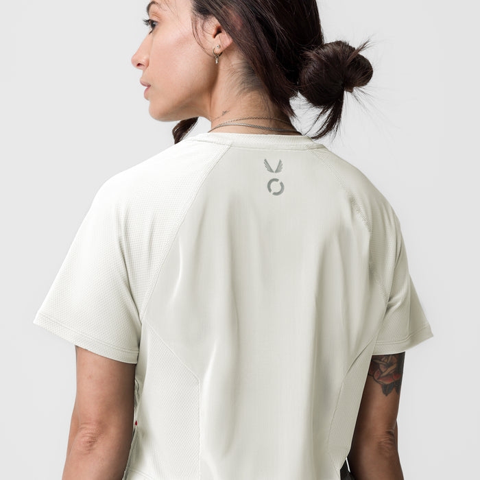 ASRV AeroSilver Cropped Training Tee in ivory cream, worn by model, back view