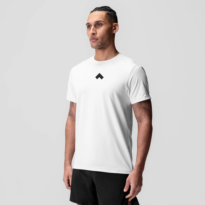 White Essential Tee with black chevron logo, worn by model, front view