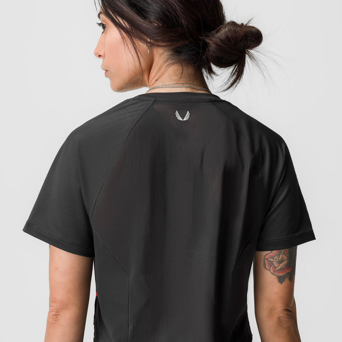 Black AeroSilver cropped training tee worn by model, back view
