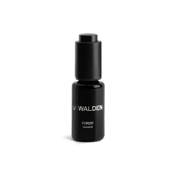 flatlay ASRV x Walden Forest Essential Oil bottle in black, front view