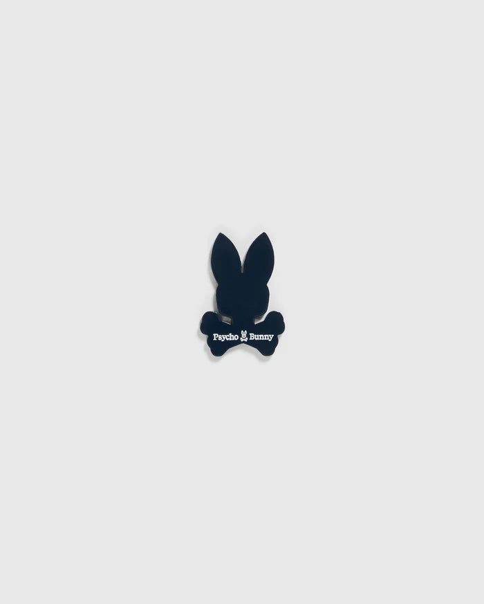 A small black silhouette of a bunny head with long ears and crossbones underneath, featuring the text "Psycho Bunny" in white below the head and above the crossbones, designed as an edgy BALL MARKER - B6A698C200 perfect for any golfer's collection by Psycho Bunny.
