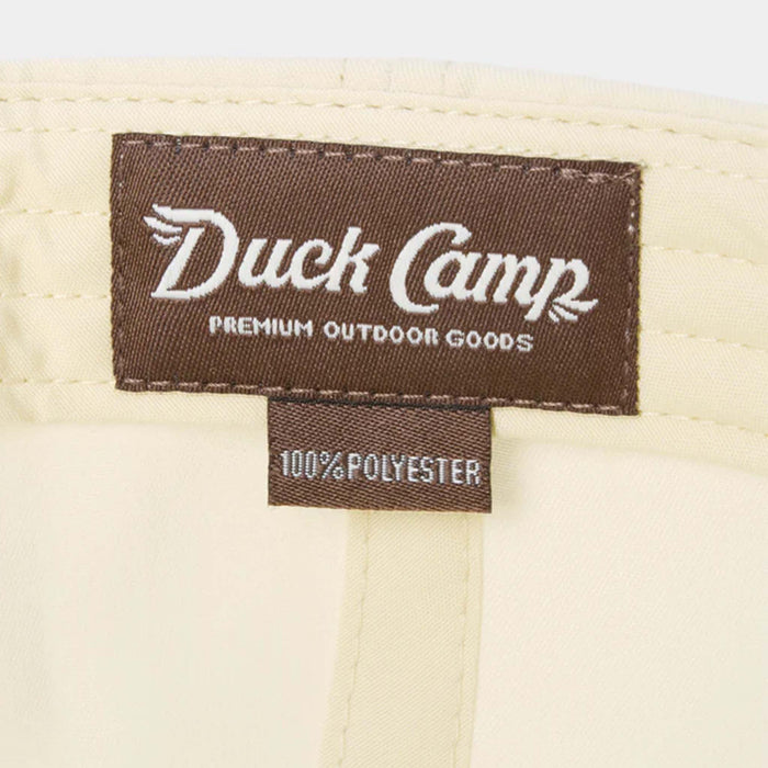 Duck Camp label on a beige background