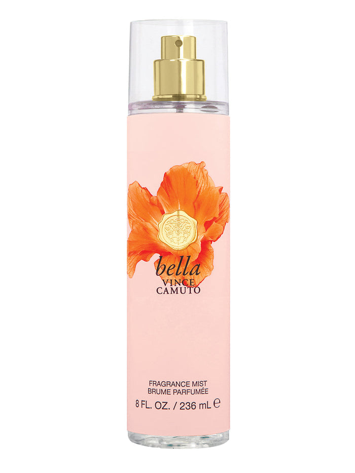 A tall, clear 8.0 oz bottle of Bella Body Mist by Vince Camuto features a gold nozzle and an orange flower design set against a peach background. The fragrance mist is beautifully infused with notes of nectarine blossom and Italian bergamot, creating a fresh and elegant scent.