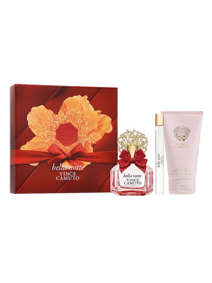 The Vince Camuto Bella Notte 3-Piece Set includes a floral perfume bottle with gold cap and red bow, a women’s rollerball fragrance, body lotion, and comes in a red floral gift box.