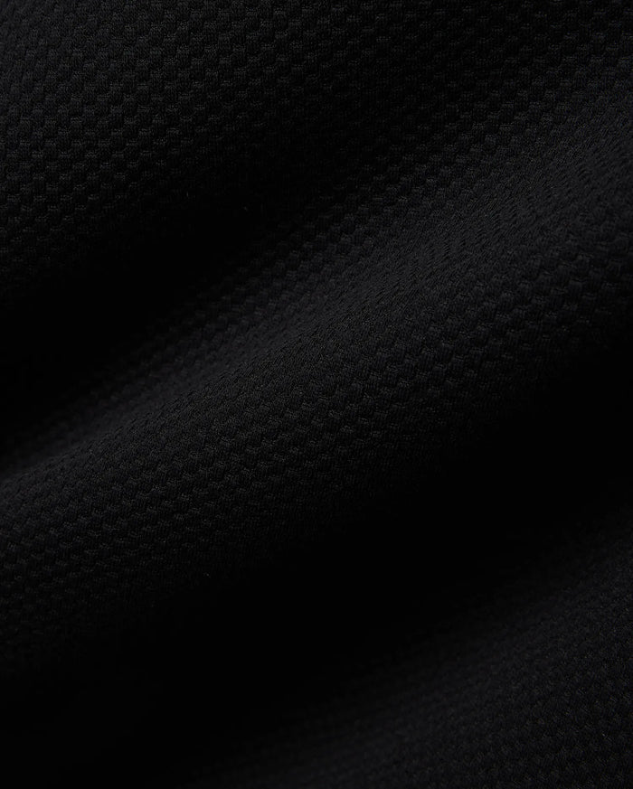 Mens Big And Tall Marc Textured 1/4 Zip in rich black, featuring a luxurious, finely detailed geometric pique knit fabric, embodying Psycho Bunny's refined streetwear aesthetic.
