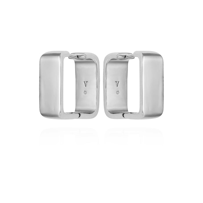 A pair of brass rectangle hoop earrings by Vince Camuto, featuring a shiny silver-tone finish and open centers in a modern style, displayed on a white background.