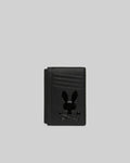 Black textured leather Bunny Card Case featuring multiple card slots and a prominent, glossy black Psycho Bunny skull logo centered on the front.