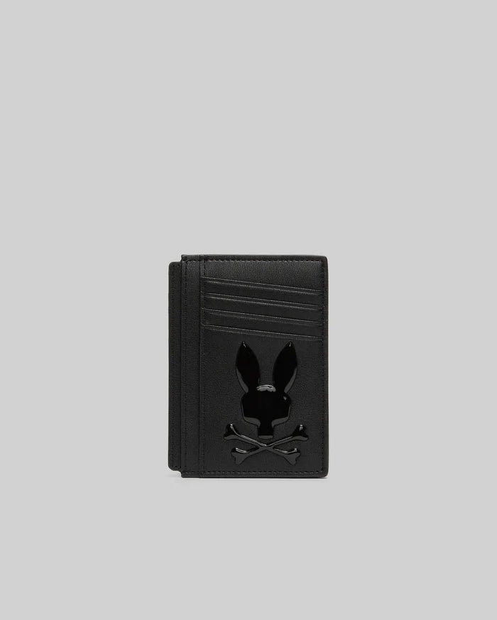Black textured leather Bunny Card Case featuring multiple card slots and a prominent, glossy black Psycho Bunny skull logo centered on the front.