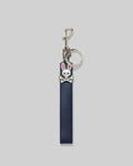 Premium Navy Blue Leather Bunny Keychain featuring a smooth texture, polished silver hardware, and a small, detailed white and pink Psycho Bunny skull logo charm.