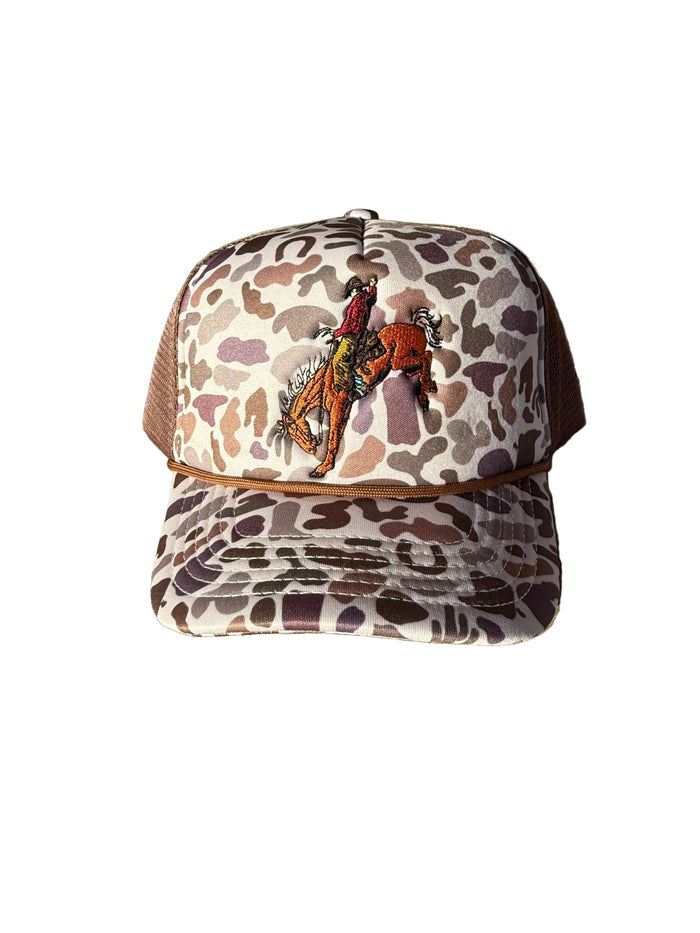 Camouflage-patterned cap with a graphic of a person on a horse on a white background