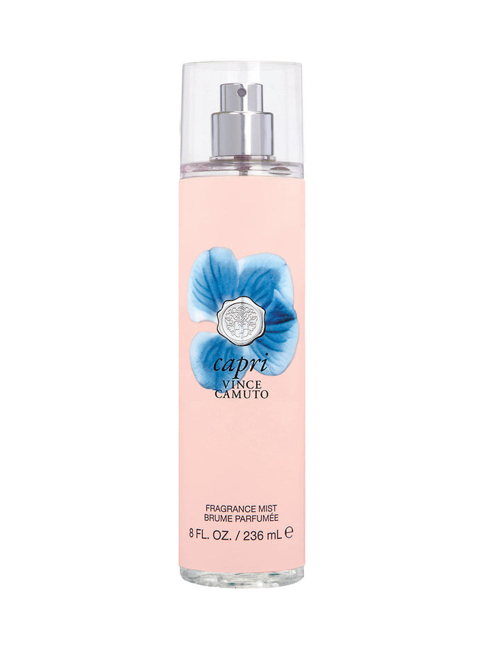 Capri Body Mist 8.0 oz by Vince Camuto comes in a clear spray bottle with a pink label, blue flower graphic, and silver cap. It offers a floral fruity fragrance highlighted by a refreshing citrus blend.