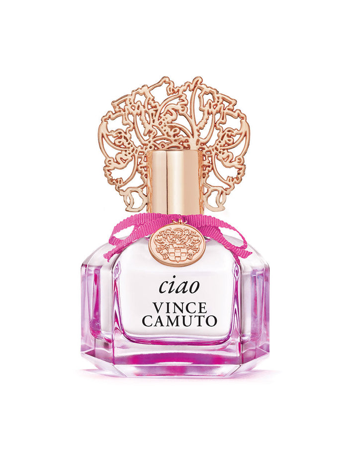 The Ciao 3.4 oz Eau de Parfum Spray by Vince Camuto comes in a clear pink bottle with a gold decorative cap and a pink ribbon around the neck, beautifully capturing bright citrus notes layered over soft musk and vanilla undertones.