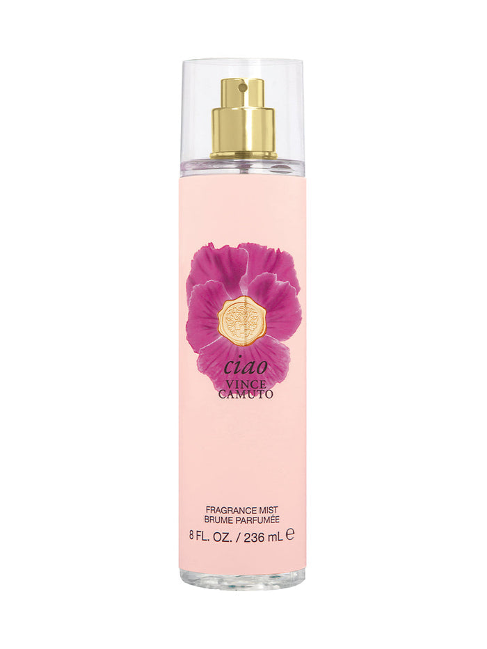 A clear bottle of Vince Camuto Ciao Body Mist 8.0 oz features a gold spray top, an eye-catching large purple flower graphic, and text indicating 8 fl. oz. (236 mL) on the front. This alluring fragrance combines uplifting citrus with soft musk and vanilla notes, capturing the breezy sophistication of the Mediterranean sea.