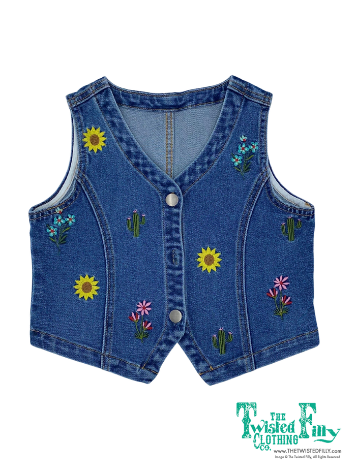 Blue denim vest with floral and cactus designs on a white background, branded 'The Twisted Filly'.
