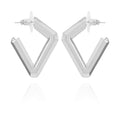 Diamond Shaped Hoop Earrings by Vince Camuto—these geometric, silver-toned V-shaped hoops with post backings are displayed upright on a white background with a subtle reflection below, delivering a modern and chic twist on the classic diamond earring silhouette.
