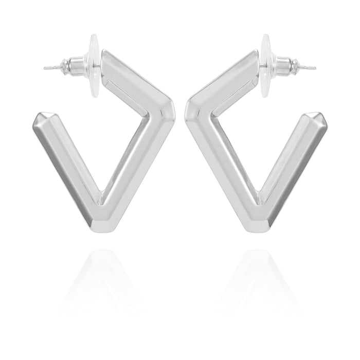 Diamond Shaped Hoop Earrings by Vince Camuto—these geometric, silver-toned V-shaped hoops with post backings are displayed upright on a white background with a subtle reflection below, delivering a modern and chic twist on the classic diamond earring silhouette.