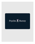 A stylish rectangular black card showcases the "Psycho Bunny" brand in sharp white lettering, accompanied by a logo featuring a bunny head with skull and crossbones beneath it. This Psycho Bunny Digital Gift Card is an ideal choice for fashionable gifts—redeem during checkout to enhance your shopping journey.