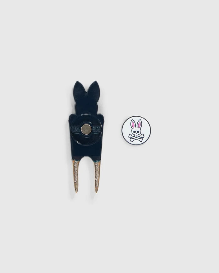 A black Psycho Bunny DIVOT TOOL - B6A699C200 with a bunny-shaped top and a round white magnetic ball marker featuring a pink bunny logo and crossed bones underneath, both placed on a plain white background, makes for perfect golf gifts.