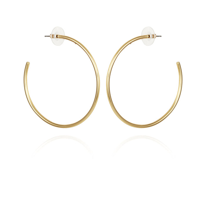 A pair of Extra Large Open Hoop Earrings by Vince Camuto in simple gold, featuring post backs with clear round earring backs, displayed on a white background—perfect for adding a trendy touch to any look.
