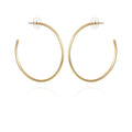 A pair of Extra Large Open Hoop Earrings by Vince Camuto in simple gold, featuring post backs with clear round earring backs, displayed on a white background—perfect for adding a trendy touch to any look.