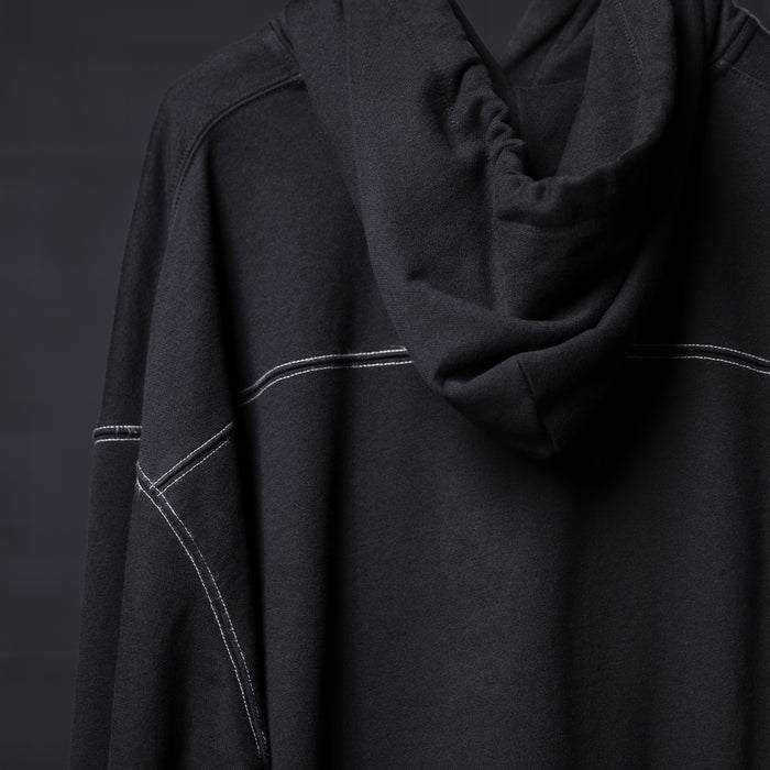 FA'20 Contrast Thread Hoodie in black with white contrast stitching, worn on model