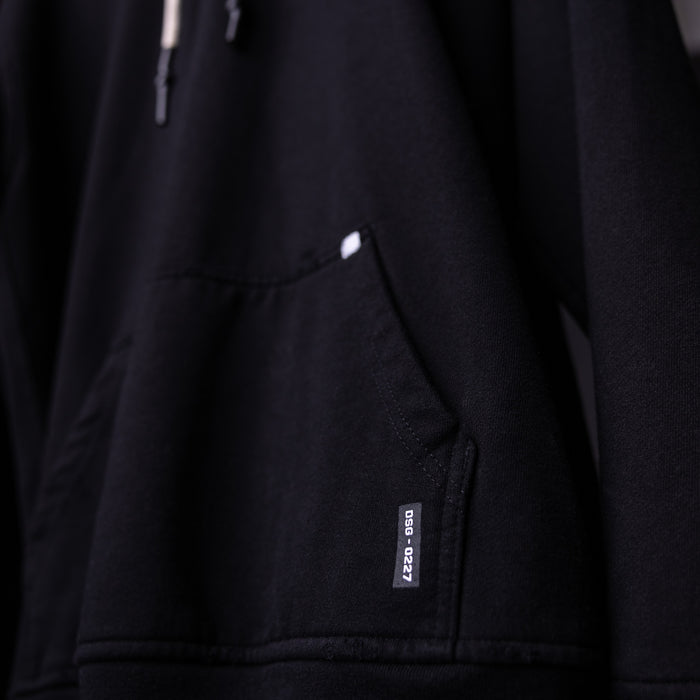 FA'20 Distressed Hoodie in black, detail shot of pocket and label