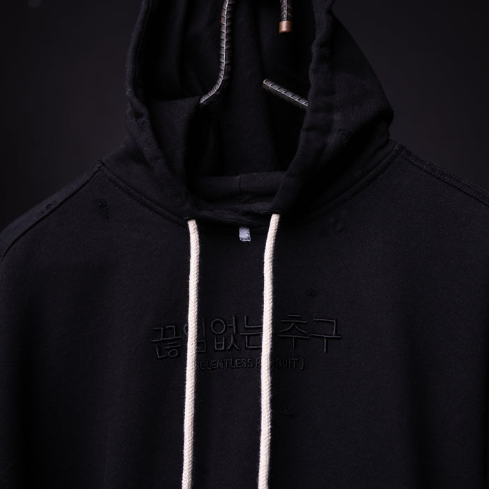 FA'20 Distressed Hoodie in black with white drawstrings, front view on model
