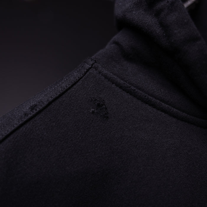 FA'20 Distressed Hoodie in black, fabric detail closeup showing texture and distressing